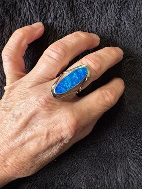 Sterling Silver Large Blue (Oval) Opal Cocktail Ring. 
Quality Artisan Jeweller.